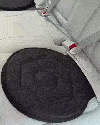 Person showing swiveling pad to place in car seat to make rotation easier.